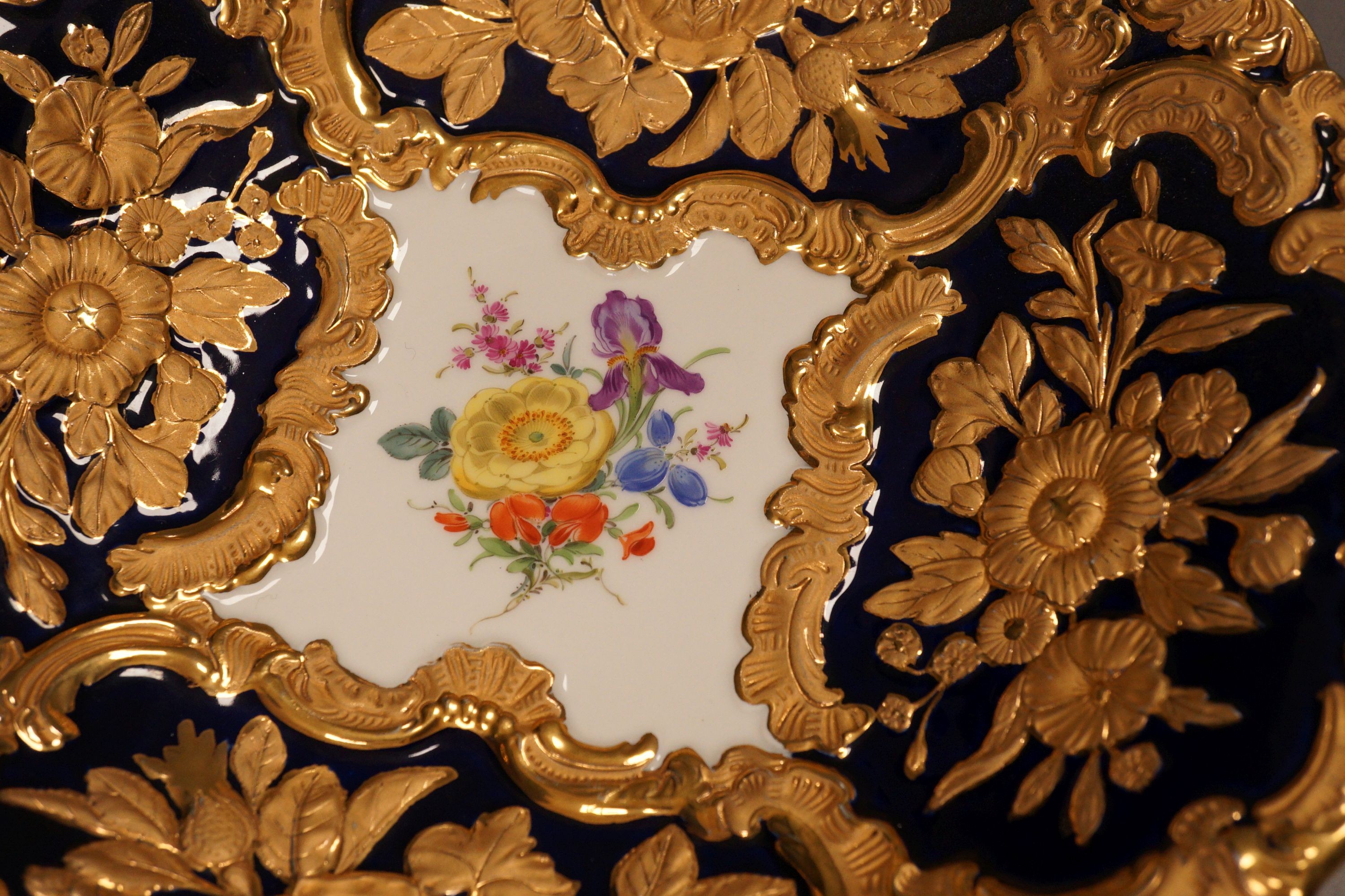 An early 20th Meissen century gilt floral blue and white dish, 27.5cm diameter